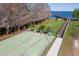 Overhead shot of shuffleboard court, park benches and dock access to lake at 11642 Martell Ct, Leesburg, FL 34788