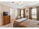 Bedroom with two windows for natural light, closet plus an en-suite bathroom at 11642 Martell Ct, Leesburg, FL 34788