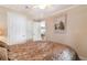 Main bedroom featuring a bed and view into the dining room at 11642 Martell Ct, Leesburg, FL 34788