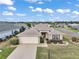 Beautiful aerial view of a single story home featuring manicured landscaping, a 2 car garage and neutral tones at 11945 Se 91St Cir, Summerfield, FL 34491