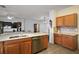 Kitchen island with dishwasher sink and open design looking into living room at 11945 Se 91St Cir, Summerfield, FL 34491