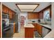 Kitchen featuring stainless steel appliances and center island at 12338 S Putney Ct, Leesburg, FL 34788