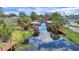 Scenic view of waterfront canals showcasing boat docks and lush landscaping, perfect for boating enthusiasts at 12338 S Putney Ct, Leesburg, FL 34788