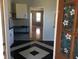 View of the entryway, with a kitchen view and hardwood floors at 13738 State Road 33, Groveland, FL 34736