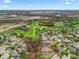 Drone view showing home near golf course at 1415 Bethune Way, The Villages, FL 32162