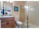 Clean bathroom featuring a glass-enclosed shower, toilet, and vanity with modern fixtures at 14157 Oasis Cove Blvd # 104, Windermere, FL 34786