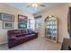 Comfortable bedroom with a full size couch, decor, and sunlit windows at 14157 Oasis Cove Blvd # 104, Windermere, FL 34786