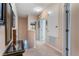 Upstairs hallway featuring neutral walls, carpeted floors, and plenty of natural light at 14157 Oasis Cove Blvd # 104, Windermere, FL 34786