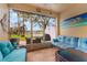 Relaxing screened patio with lake views, comfortable seating, and lots of natural light at 14157 Oasis Cove Blvd # 104, Windermere, FL 34786