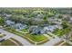 An aerial view shows a well-kept home with mature trees and established landscaping at 14736 Pine Cone Trl, Clermont, FL 34711