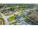 An aerial view of a home with a well-maintained lawn and manicured landscaping at 14736 Pine Cone Trl, Clermont, FL 34711