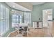 Cozy breakfast nook with lots of sunlight, complemented by the natural light from the adjacent window at 14736 Pine Cone Trl, Clermont, FL 34711