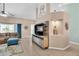 Cozy living room featuring neutral tones, tile flooring, and modern decor at 14736 Pine Cone Trl, Clermont, FL 34711