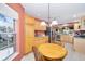 Bright breakfast nook adjacent to the kitchen with a large window at 1537 Eastover Ter, The Villages, FL 32162