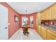 Cozy breakfast nook with bright natural light and matching kitchen cabinetry at 1537 Eastover Ter, The Villages, FL 32162