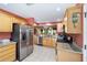 Well-equipped kitchen with stainless steel appliances and ample counter space at 1537 Eastover Ter, The Villages, FL 32162