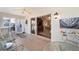 View of the tile-floored lanai leading to a spacious living area through sliding glass doors at 1537 Eastover Ter, The Villages, FL 32162