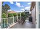 Cozy back patio with a small table and grill, perfect for enjoying the landscaped yard at 1537 Eastover Ter, The Villages, FL 32162