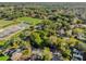 Scenic aerial shot revealing lush greenery, tree coverage, and the surrounding neighborhood at 1620 N Rhodes St, Mount Dora, FL 32757