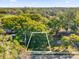 An aerial view of a land lot surrounded by lush trees at 1620 N Rhodes St, Mount Dora, FL 32757