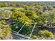 Aerial view of property nestled in a leafy neighborhood at 1620 N Rhodes St, Mount Dora, FL 32757