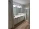 Bright bathroom with a shower and ample vanity space at 1661 Stafford Springs Blvd, Mount Dora, FL 32757