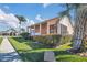 Beautiful home exterior featuring a screened lanai, lush landscaping, and a well-maintained lawn at 16628 Citrus Pkwy, Clermont, FL 34714