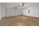 Spacious garage with a roll-up door and ample room for vehicles and storage at 16628 Citrus Pkwy, Clermont, FL 34714