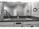 Bathroom with double sinks, granite counters, and ample cabinet space at 17108 Se 111Th Terrace Rd, Summerfield, FL 34491