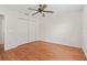 Bedroom with wood floors and large closet at 1713 El Nino St, The Villages, FL 32162