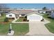 This is an aerial view of a charming home with a well-manicured front yard at 17937 Se 107Th Ter, Summerfield, FL 34491