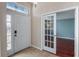 Welcoming entryway with front door and glass-paneled door to an adjacent room at 1801 Summit Oaks Cir, Minneola, FL 34715