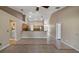 Open-concept living space featuring tile floors and open flow into the kitchen at 1801 Summit Oaks Cir, Minneola, FL 34715