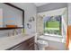 Cozy bathroom features a bathtub with shower and single sink at 18944 Bates Ave, Eustis, FL 32736