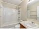 Bathroom with a bath tub and shower, toilet, mirror, and vanity at 201 Andover Dr, Davenport, FL 33897