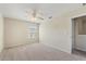 Bedroom with neutral walls, carpet, ceiling fan and bright window at 201 Andover Dr, Davenport, FL 33897