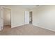 A neutral bedroom featuring carpet, closet, a door to another room at 201 Andover Dr, Davenport, FL 33897