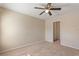 Well-lit bedroom with neutral tones, carpet flooring and a door to closet at 201 Andover Dr, Davenport, FL 33897