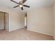 Comfortable bedroom featuring neutral walls, carpet flooring and a walk in closet at 201 Andover Dr, Davenport, FL 33897