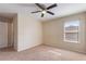 Bright bedroom with a ceiling fan and neutral carpet flooring providing a calm space at 201 Andover Dr, Davenport, FL 33897