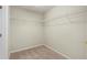 Walk-in closet featuring carpeted floors and wire shelving for storage at 201 Andover Dr, Davenport, FL 33897