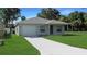 Charming single Gathering home with a one car garage, complemented by a well-maintained lawn at 2030 N Highland St, Mount Dora, FL 32757