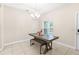 A bright dining area showcases tile floors, a modern light fixture, and a breakfast table with bench seating at 215 Elm Ct, Kissimmee, FL 34759