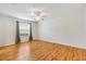 Light-filled bedroom with wood floors, neutral walls, and window at 2245 Hanover Ter, The Villages, FL 32162