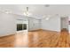 Bright living room with sliding glass doors and hardwood floors at 2245 Hanover Ter, The Villages, FL 32162