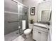 Bathroom features gray tiled shower, granite countertop vanity, and modern fixtures at 2313 Hamilton Ridge Road, Clermont, FL 34715