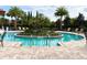 Community pool with a center island and clear blue water at 2313 Hamilton Ridge Road, Clermont, FL 34715