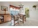 Eat-in dining area featuring a modern chandelier, with windows and tile floors at 25274 Lost Oak Cir, Leesburg, FL 34748