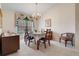 Formal dining room featuring matching furniture, window treatments, and decor with carpeted floors at 25274 Lost Oak Cir, Leesburg, FL 34748