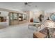 Bright and airy living room with display cabinets, vaulted ceiling, and a ceiling fan at 25274 Lost Oak Cir, Leesburg, FL 34748